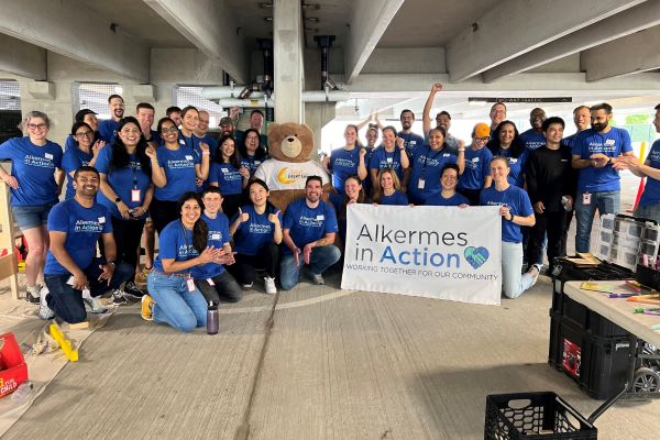 Employees standing together with Alkermes in Action on their sahirts